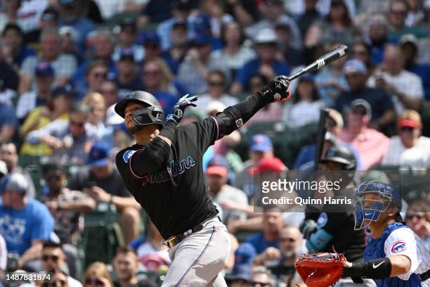 Yuli Gurriel of the Miami Marlins hits a sacrifice fly in the sixth inning against the Chicago Cubs at Wrigley Field on May 05, 2023 in Chicago,...