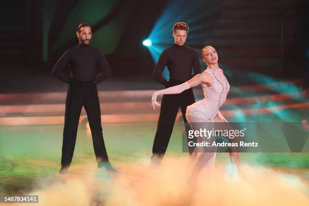 Massimo Sinato, Anna Ermakova and Valentin Lusin dance on stage during the 10th "Let's Dance" show at MMC Studios on May 05, 2023 in Cologne, Germany.