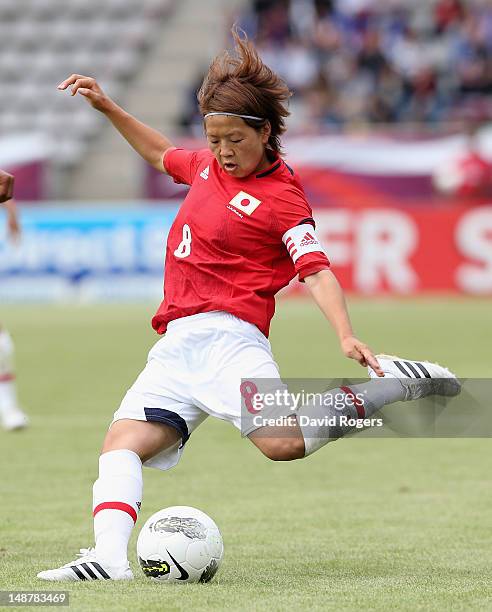 Aya Miyama of Japan passes the ball during the friendly international match between Japan Women and France Women at Stade Charlety on July 19, 2012...