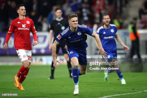 Marius Bulter of Schalke celebrates scoring his teams third goal of the game from the penalty spot during the Bundesliga match between 1. FSV Mainz...