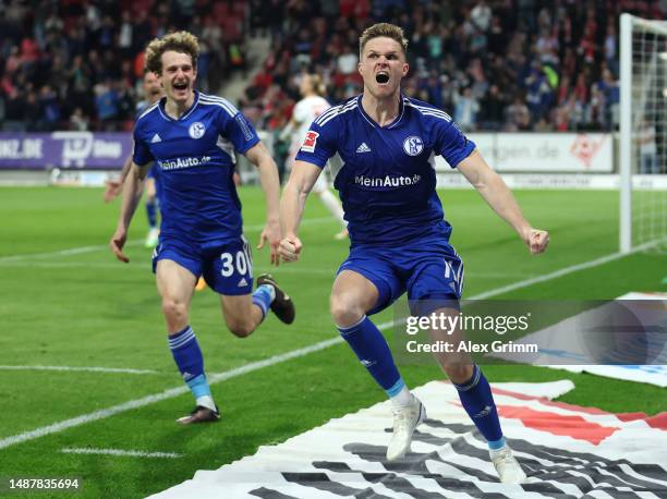 Marius Bulter of Schalke celebrates scoring his teams third goal of the game from the penalty spot during the Bundesliga match between 1. FSV Mainz...