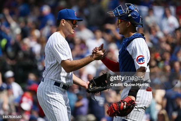 Miguel Amaya and Matt Mervis of the Chicago Cubs celebrate after the 4-1 win against the Miami Marlins at Wrigley Field on May 05, 2023 in Chicago,...