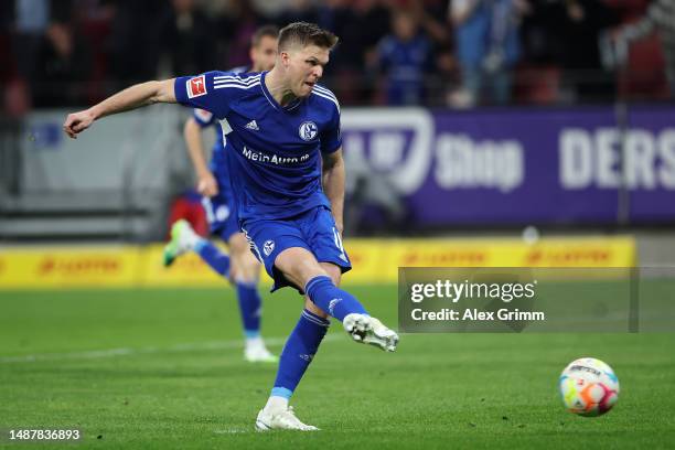 Marius Bulter of Schalke takes and scores his teams third goal of the game from the penalty spot during the Bundesliga match between 1. FSV Mainz 05...