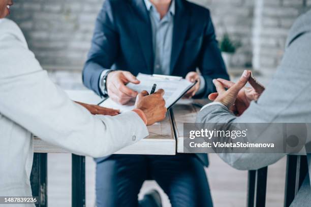 couple meeting with financial advisor. - bank loan stockfoto's en -beelden