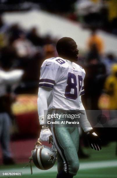 Wide Receiver Michael Irvin of the Dallas Cowboys follows the action in the game between the Dallas Cowboys vs the Philadelphia Eagles on October 26,...