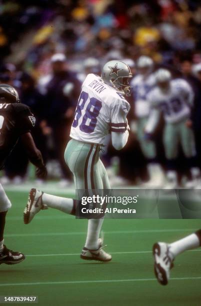 Wide Receiver Michael Irvin of the Dallas Cowboys has a short gain in the game between the Dallas Cowboys vs the Philadelphia Eagles on October 26,...