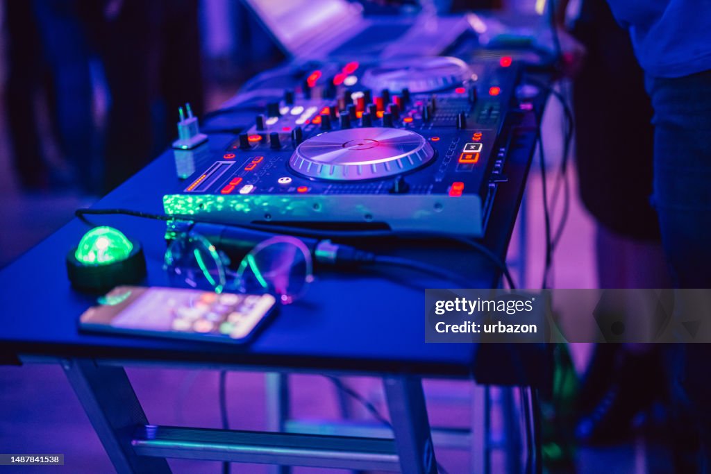 DJ console mixer at club