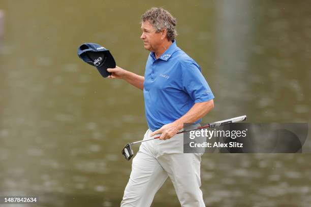 Lee Janzen of the United States reacts after sinking a birdie putt on the 18th green during the first round of the Mitsubishi Electric Classic at TPC...