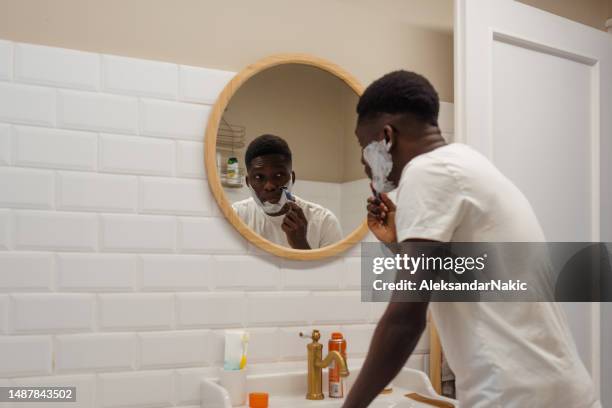 shaving time - afro man washing stock pictures, royalty-free photos & images