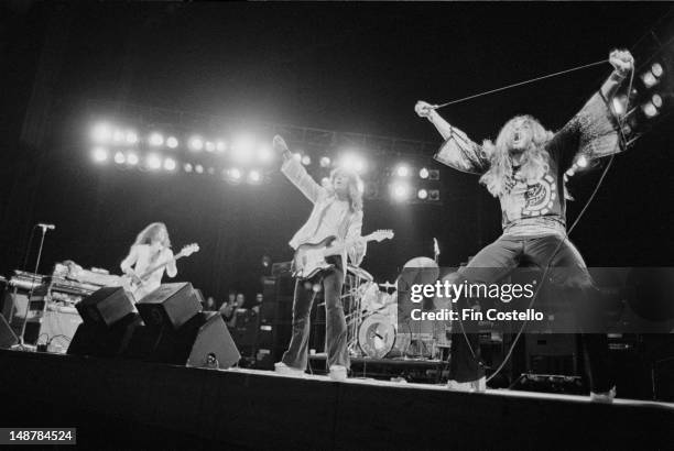 English rock group Deep Purple perform live on stage in Japan in December 1975. Left to right: keyboard player Jon Lord, bassist Glenn Hughes,...