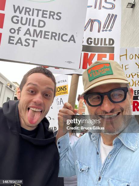 Pete Davidson and Judah Miller join members of the Writers Guild of America and its supporters to picket outside Silvercup Studios on May 5, 2023 in...