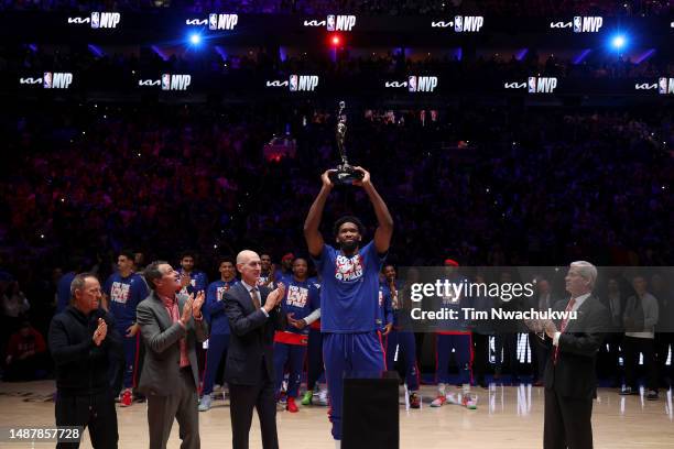 Joel Embiid of the Philadelphia 76ers hoist the MVP trophy after being named 2022-23 Kia NBA Most Valuable Player prior to game three of the Eastern...