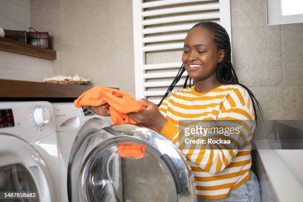 Black Woman Washing Machine Photos and Premium High Res Pictures ...