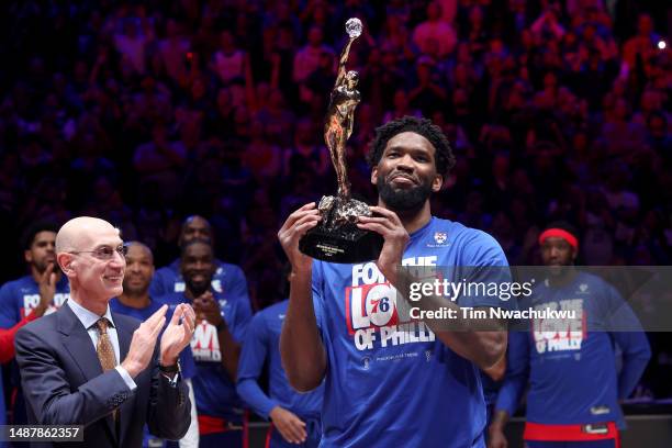 Joel Embiid of the Philadelphia 76ers hoist the MVP trophy after being named 2022-23 Kia NBA Most Valuable Player prior to game three of the Eastern...