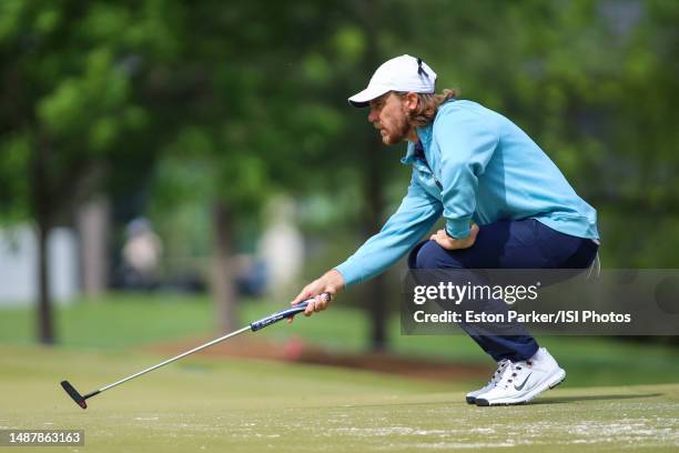 Tommy Fleetwood of England lines up before his putt on the fourth hole during round two of the Wells Fargo Championship at Quail Hollow Club on May...