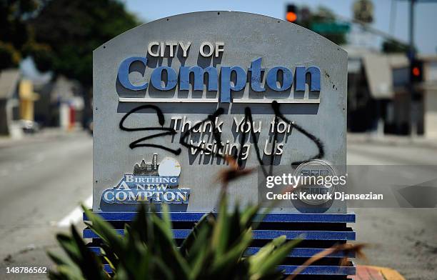Compton city sign is tagged with graffiti on July 19, 2012 in Compton, California. The City of Compton located south of Los Angeles with a population...