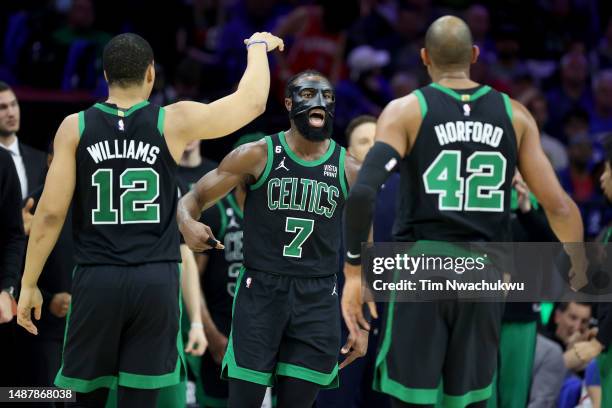 Jaylen Brown of the Boston Celtics celebrates a basket with Grant Williams and Al Horford against the Philadelphia 76ers during the third quarter in...