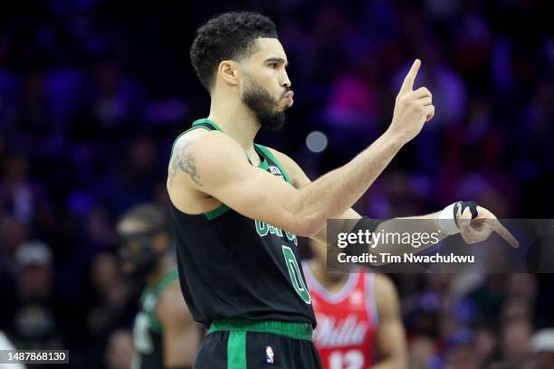 Jayson Tatum of the Boston Celtics celebrates a basket against the Philadelphia 76ers during the third quarter in game three of the Eastern...