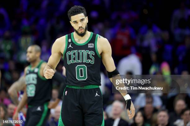 Jayson Tatum of the Boston Celtics celebrates a basket against the Philadelphia 76ers during the fourth quarter in game three of the Eastern...