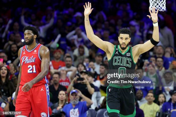 Jayson Tatum of the Boston Celtics reacts against Joel Embiid of the Philadelphia 76ers during the fourth quarter in game three of the Eastern...