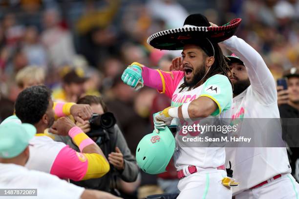 Rougned Odor puts a sombrero on Fernando Tatis Jr. #23 of the San Diego Padres after his solo homerun during the third inning of a game against the...