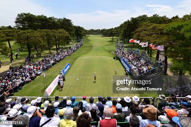 Yuri Yoshida of Japan stands on the 1st tee as she is introduced to gallery during the third round of World Ladies Championship Salonpas Cup at...