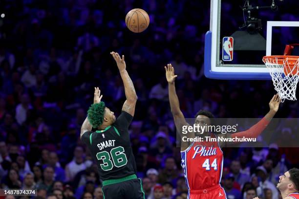 Marcus Smart of the Boston Celtics shoots the ball against Paul Reed of the Philadelphia 76ers during the fourth quarter in game three of the Eastern...