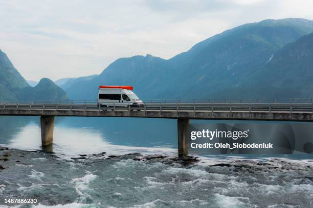 camper van on bridge across the river in norway - bridge side view stock pictures, royalty-free photos & images