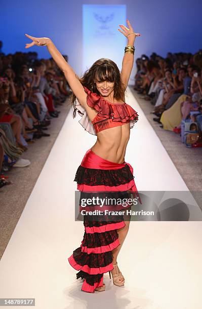 Karina Smirnoff walks the runway at the Lisa Blue show during Mercedes-Benz Fashion Week Swim 2013 at The Raleigh on July 19, 2013 in Miami Beach,...