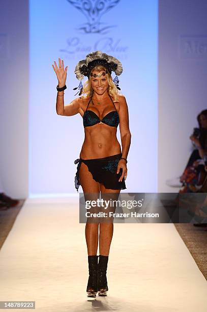 Designer Lisa Burke walks the runway at the Lisa Blue show during Mercedes-Benz Fashion Week Swim 2013 at The Raleigh on July 19, 2013 in Miami...