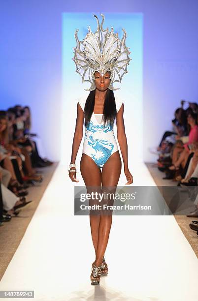 Model walks the runway at the Lisa Blue show during Mercedes-Benz Fashion Week Swim 2013 at The Raleigh on July 19, 2013 in Miami Beach, Florida.