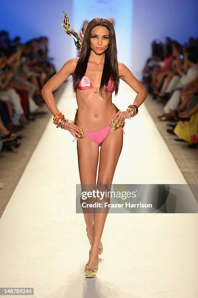 Model walks the runway at the Lisa Blue show during Mercedes-Benz Fashion Week Swim 2013 at The Raleigh on July 19, 2013 in Miami Beach, Florida.