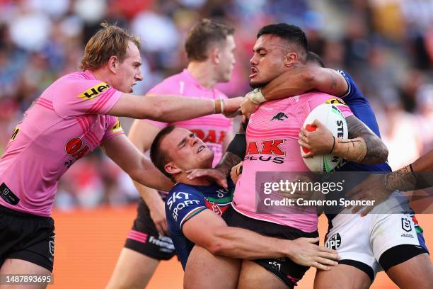 Spencer Leniu of the Panthers is tackled during the round 10 NRL match between the New Zealand Warriors and Penrith Panthers at Suncorp Stadium on...