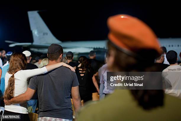 Relatives of the five Israelis who were killed during the terror attack on a tour bus in Burgas, Bulgaria, mourn during a ceremony at the Ben Gurion...