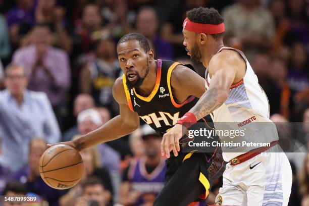 Kevin Durant of the Phoenix Suns handles the ball against Bruce Brown of the Denver Nuggets during the second half of Game Three of the NBA Western...