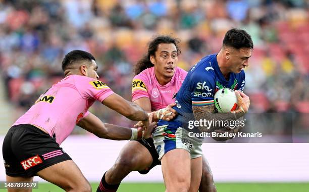 Charnze Nicoll-Klokstad of the Warriors is tackled during the round 10 NRL match between the New Zealand Warriors and Penrith Panthers at Suncorp...