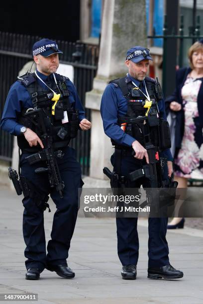 Armed Metropolitan Police officers on patrol ahead of the Coronation of King Charles III and Queen Camilla on May 06, 2023 in London, England. The...