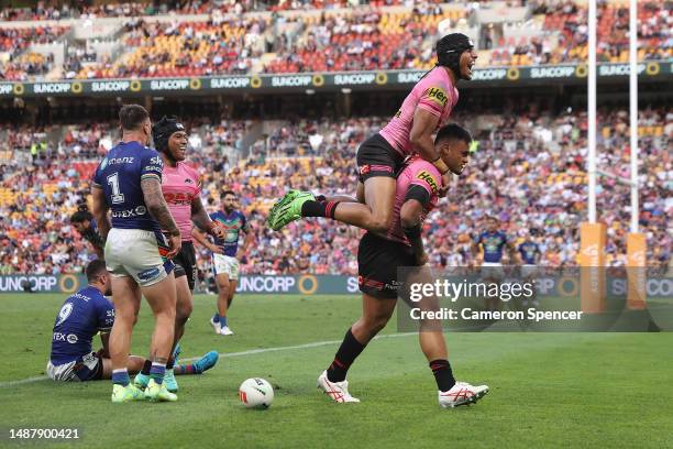 Spencer Leniu of the Panthers celebrates scoring a try during the round 10 NRL match between the New Zealand Warriors and Penrith Panthers at Suncorp...