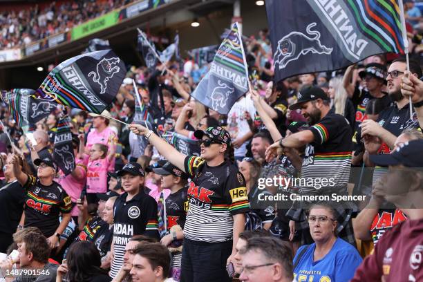 Panthers fans celebrate during the round 10 NRL match between the New Zealand Warriors and Penrith Panthers at Suncorp Stadium on May 06, 2023 in...