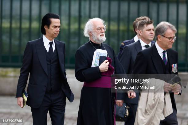 Nick Cave and Rowan Williams arrive at Westminster Abbey ahead of the Coronation of King Charles III and Queen Camilla on May 06, 2023 in London,...