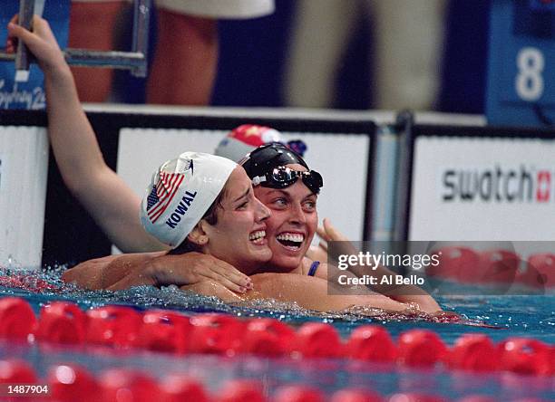 Kristy Kowal of the United States celebrates with Amanda Beard after the Women's 200 meter breaststroke at the Sydney International Aquatic Centre in...