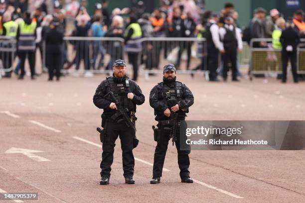 Armed Metropolitan Police officers on patrol ahead of the Coronation of King Charles III and Queen Camilla on May 06, 2023 in London, England. The...