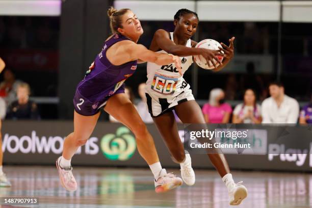 Lara Dunkley of the Firebirds and Jodi-Ann Ward of the Magpies compete for the ball during the round eight Super Netball match between Queensland...