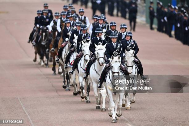Mounted police officers can be seen on the Mall ahead of the Coronation of King Charles III and Queen Camilla on May 06, 2023 in London, England. The...