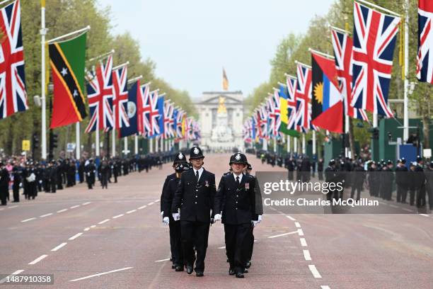 General view of Metropolitan Police officers arriving on The Mall ahead of the Coronation of King Charles III and Queen Camilla on May 06, 2023 in...