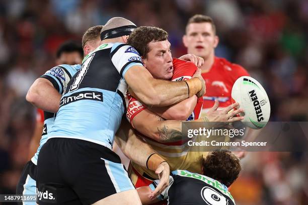 Jarrod Wallace of the Dolphins offloads the ball during the round 10 NRL match between Cronulla Sharks and Dolphins at Suncorp Stadium on May 06,...