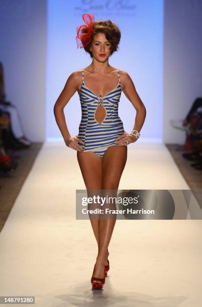 Model walks the runway at the Lisa Blue show during Mercedes-Benz Fashion Week Swim 2013 Official Coverage at The Raleigh on July 19, 2012 in Miami...