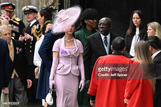 Katy Perry and Edward Enninful arrive at Westminster Abbey ahead of the Coronation of King Charles III and Queen Camilla on May 06, 2023 in London,...