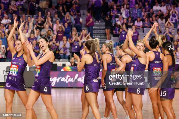 Firebird players celebrate their win during the round eight Super Netball match between Queensland Firebirds and Collingwood Magpies at Nissan Arena,...
