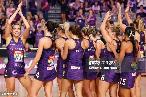 Firebird players celebrate their win during the round eight Super Netball match between Queensland Firebirds and Collingwood Magpies at Nissan Arena,...